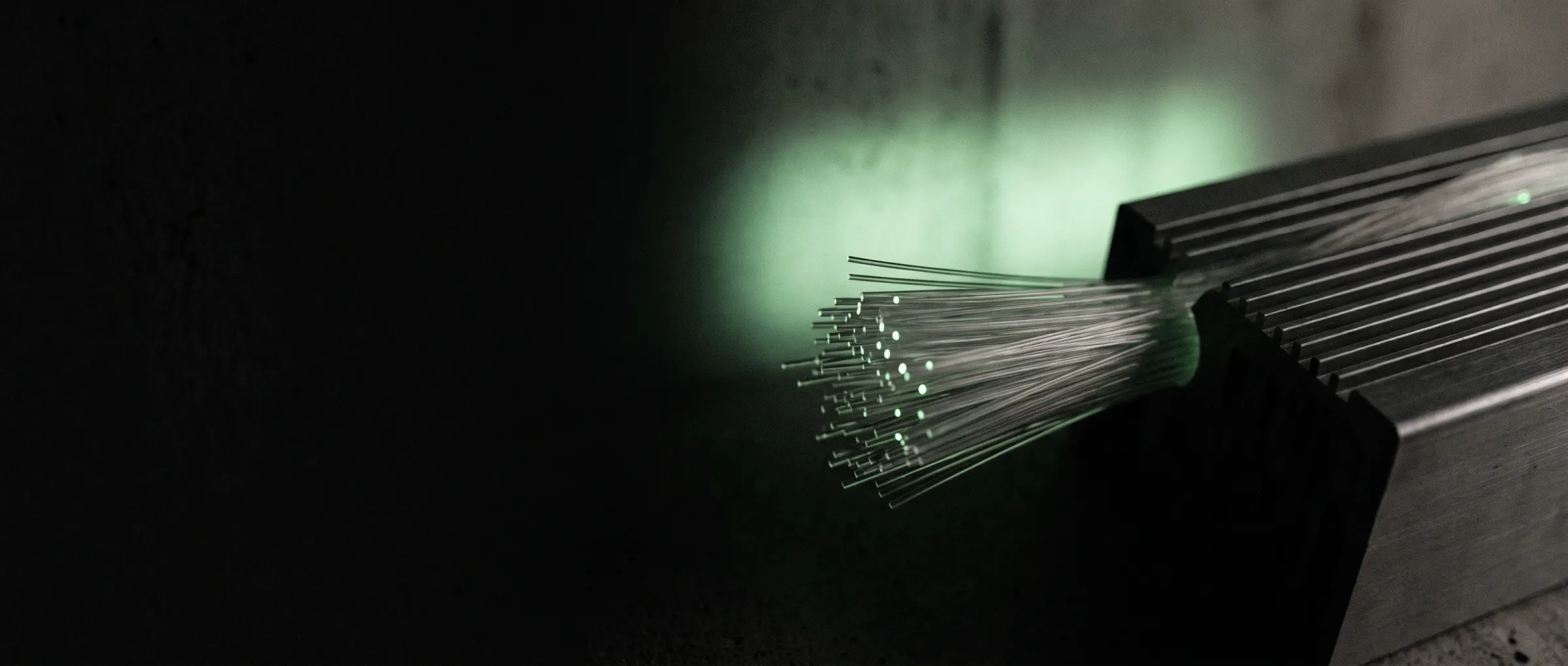 Optical fibres and machined cooling channels in the dark
